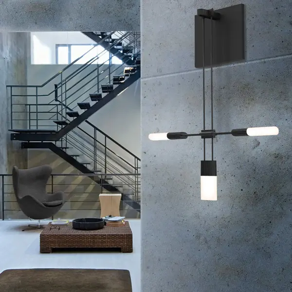 The Suspenders Single Sconce combines modern minimalist design with functional lighting. Its compact profile and etched glass cluster provide soft, diffused light ideal for hallways, bathrooms, and accent lighting applications.