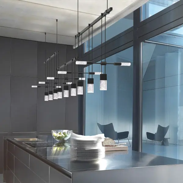 An architectural lighting system featuring three 36" power bars suspended at offset heights, creating visual depth and dimension. Crystal Chiclet luminaires provide warm, high-CRI illumination perfect for dining and entertaining spaces.