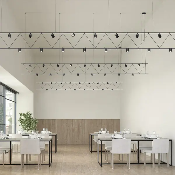 This 14-foot flat truss system combines fixed downlights with individually aimable cylinders, offering exceptional flexibility for dynamic lighting design in large spaces requiring professional-grade illumination control.