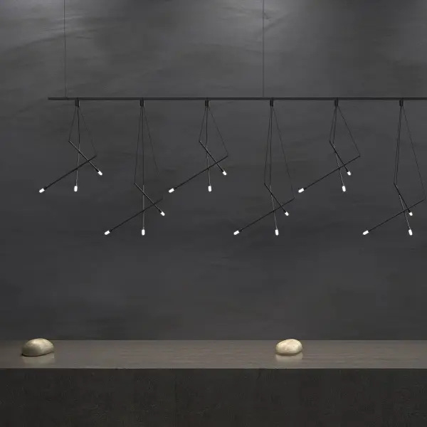 This architectural 96" linear chandelier features an organic branch arrangement with multiple LED luminaires suspended from a single point. The modular design creates a sculptural focal point perfect for large dining tables and commercial spaces.