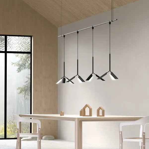 The Suspenders Linear Chandelier features three aluminum leaf reflectors on intersecting stems, creating a delicate, open composition. At 48" wide, it provides directed illumination with artistic flair, perfect for modern dining spaces.