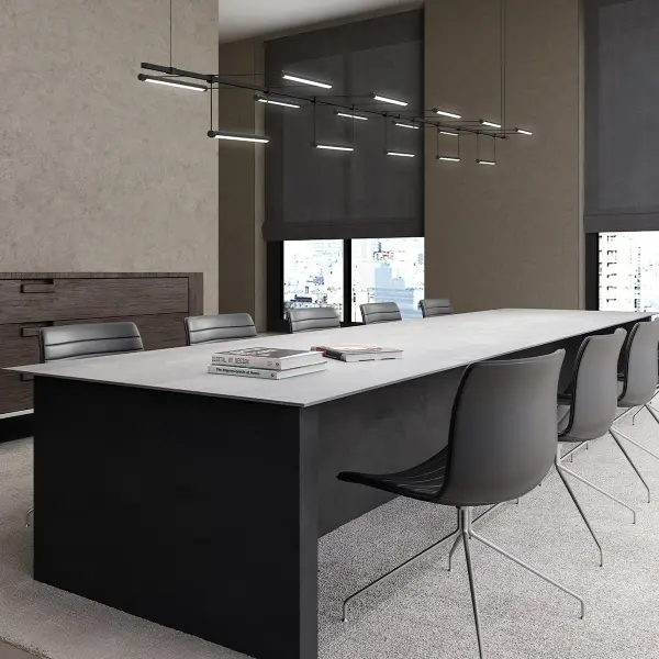 The Suspenders 96" offers exceptional versatility with rotational luminaires that adjust from downward to upward illumination. Perfect for large dining tables or commercial spaces requiring customizable lighting direction.