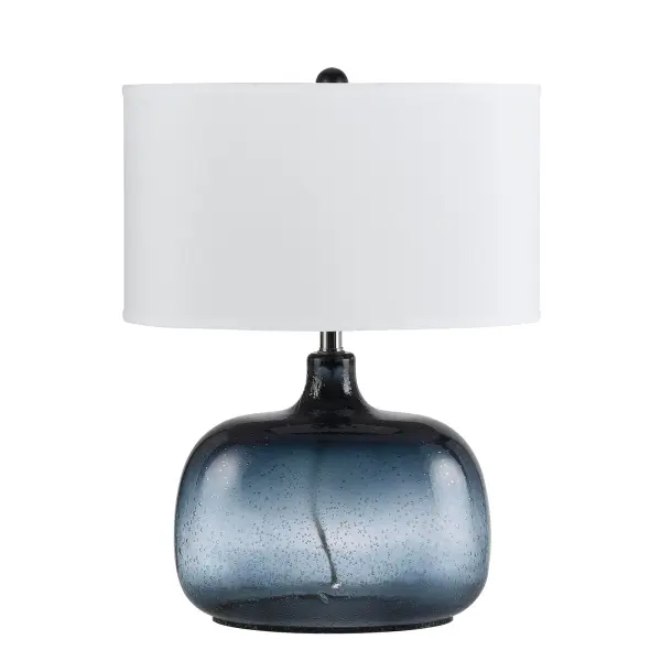 The Christi table lamp features distinctive navy blue bubble glass construction that adds coastal charm to any space. With 3-way lighting control and durable glass design, it offers both style and functionality.