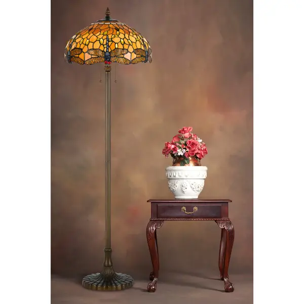 This 61-inch floor lamp showcases authentic Tiffany craftsmanship with 402 pieces of hand-cut stained glass. The durable zinc cast base in antique brass finish provides stability while dual 60W bulbs offer ample illumination. - alternate view