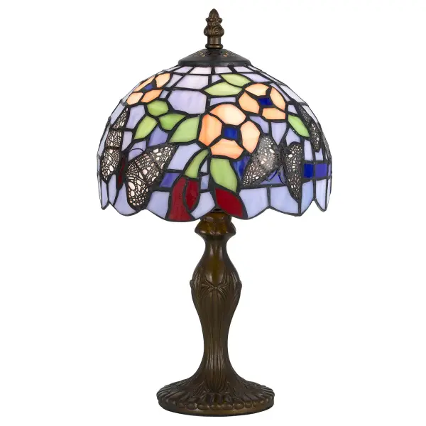 This handcrafted accent lamp features 196 pieces of authentic Tiffany stained glass paired with a durable zinc cast base in antique brass. At 14" tall, it delivers artisanal charm and warm ambient light perfect for intimate spaces.