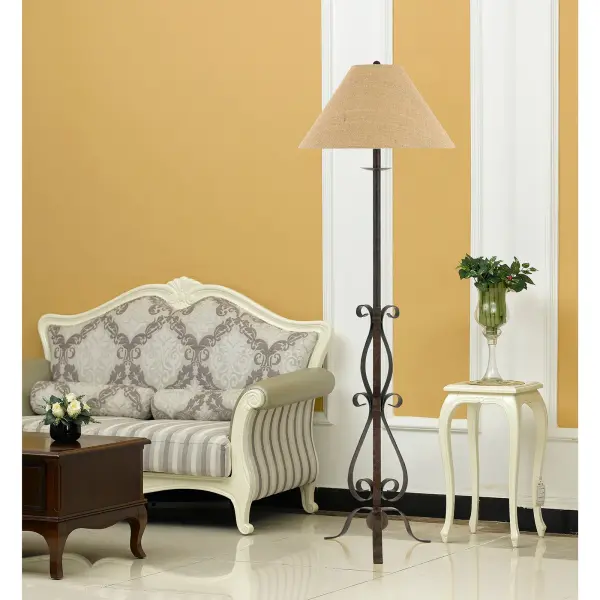 The Ekalaka floor lamp combines durable wrought iron construction with a warm rust finish and natural burlap shade. Its 61-inch height and scroll base design bring rustic elegance to any space, while the 3-way switch offers versatile lighting control. - alternate view