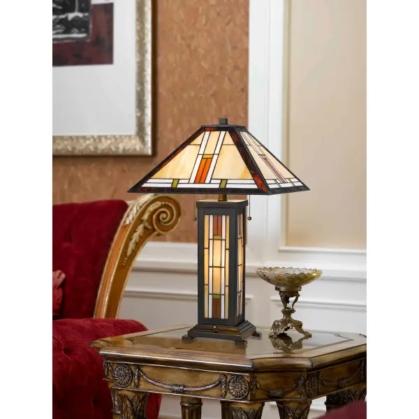 This handcrafted Tiffany-style table lamp features 226 pieces of colorful stained glass creating a warm, ambient glow. Dual pull chains control two 60W bulbs plus a 7W night light for versatile lighting options. - alternate view