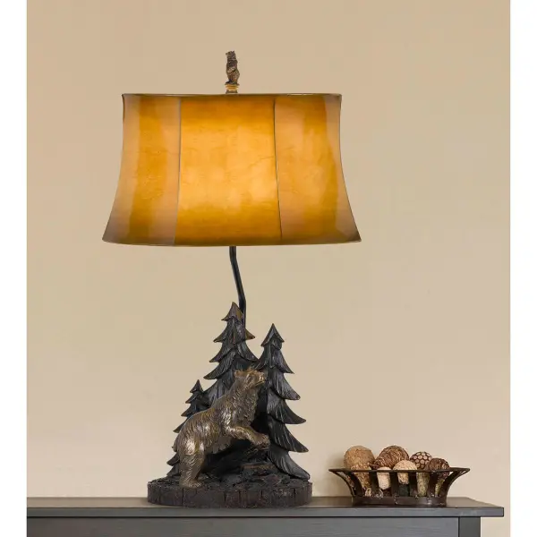This distinctive table lamp features a hand-crafted forest bear design in durable resin with a warm-toned leatherette shade. The 3-way lighting offers versatile illumination up to 150W, perfect for creating ambiance in rustic or nature-themed interiors. - alternate view