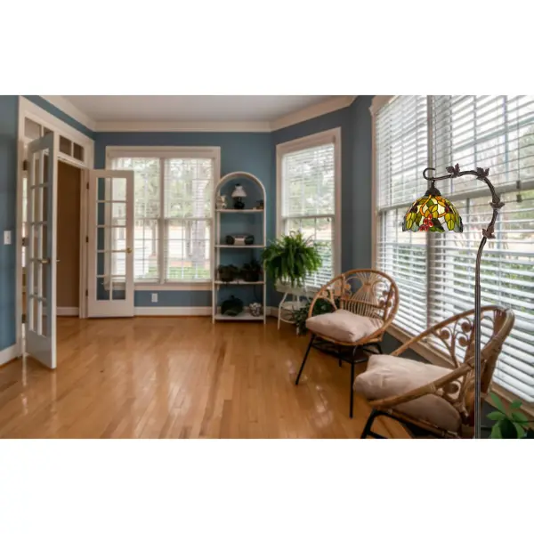 The Cotulla floor lamp features 164 pieces of hand-painted Tiffany glass in a functional downbridge design. At 61 inches tall, it provides focused task lighting with artisanal charm in a durable bronze metal construction. - alternate view