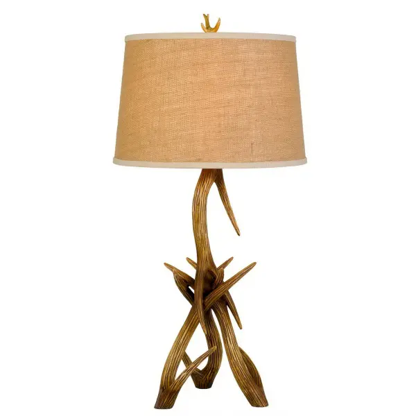 The Drummond brings authentic rustic charm with its detailed antler-inspired resin base and warm burlap shade. At 33.25" tall, this statement piece adds organic texture and lodge-style sophistication to any space.