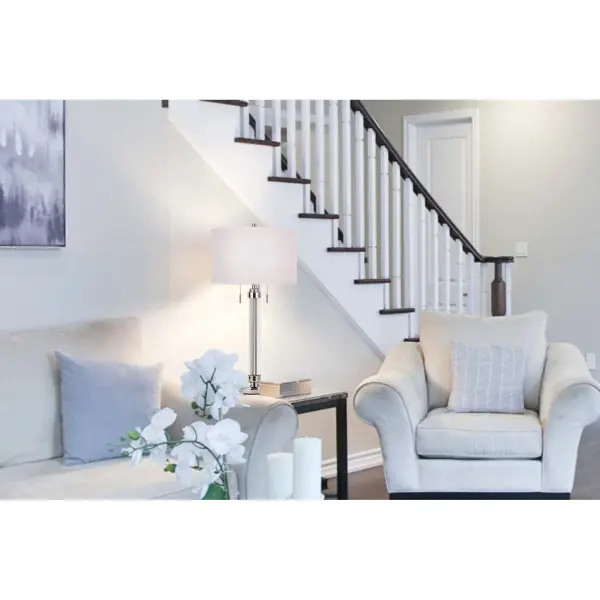 The Montilla combines durable metal construction with an acrylic outer shell and fabric drum shade for a sophisticated contemporary look. At 31" tall with dual 60W bulbs, it provides ample illumination for living spaces. - alternate view
