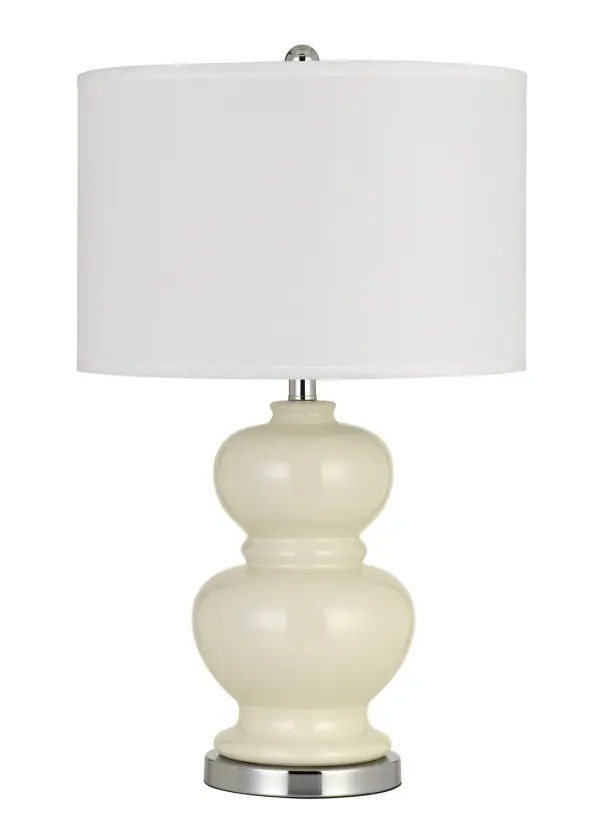 The Bergamo table lamp combines traditional elegance with practical two-light functionality. Its ivory white finish offers timeless appeal that complements various décor styles while providing flexible lighting options.