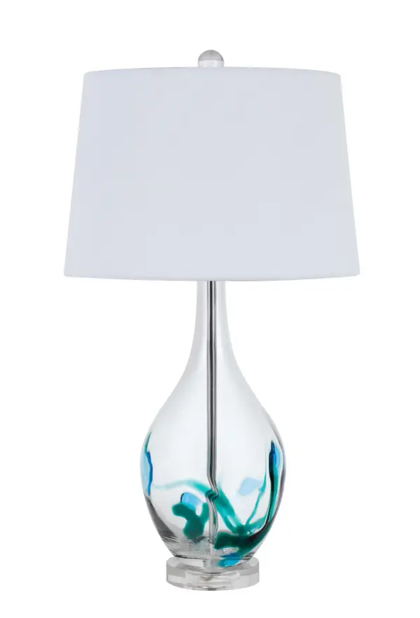 The Harlan table lamp brings coastal charm with its clear and turquoise glass construction. At 27 inches tall, it provides substantial presence while maintaining versatility for various room settings.