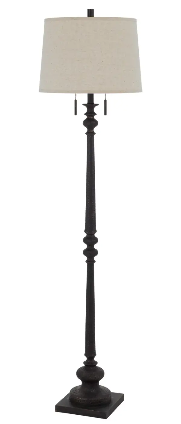 The Torrington floor lamp brings industrial charm with its rustic iron finish and two-light design. Standing at 63 inches tall, it provides versatile ambient and task lighting for living spaces, offices, or bedrooms.