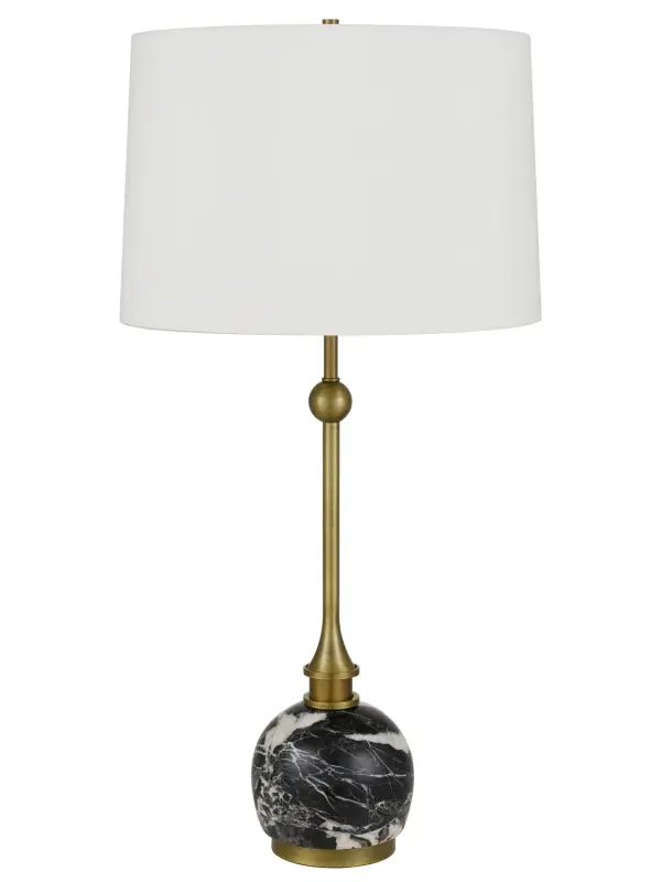 The Midlands table lamp combines warm antique brass metalwork with luxurious black marble for a refined, transitional aesthetic. At 29.25 inches tall, it provides substantial presence and ample illumination for living spaces, bedrooms, and offices.