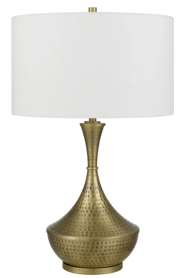 The Hove table lamp combines traditional elegance with contemporary versatility in a warm antique brass finish. At 26.75 inches tall, it provides substantial presence and ample lighting for reading or ambient illumination.