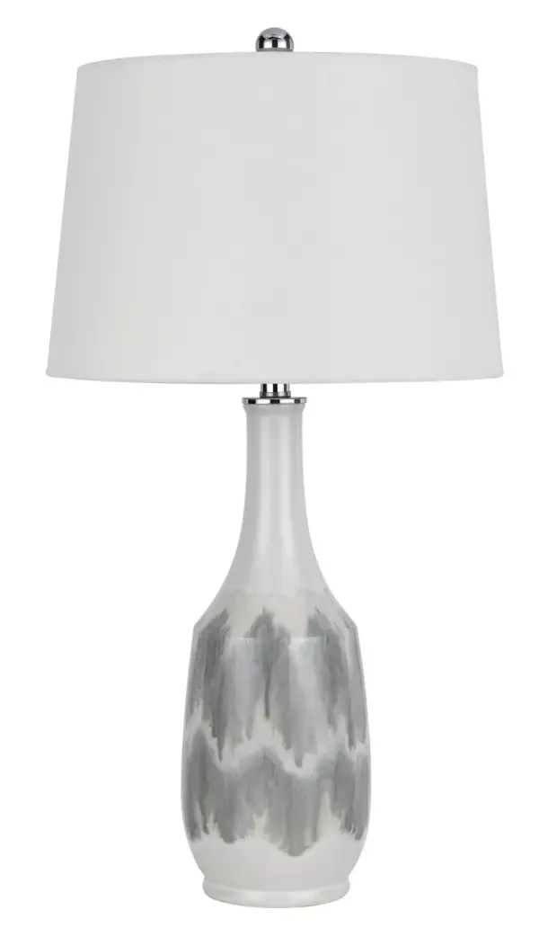 The Ely table lamp showcases natural white marble construction that brings sophisticated texture and organic beauty to any space. At 29" tall, it provides substantial presence while maintaining versatility across room styles.