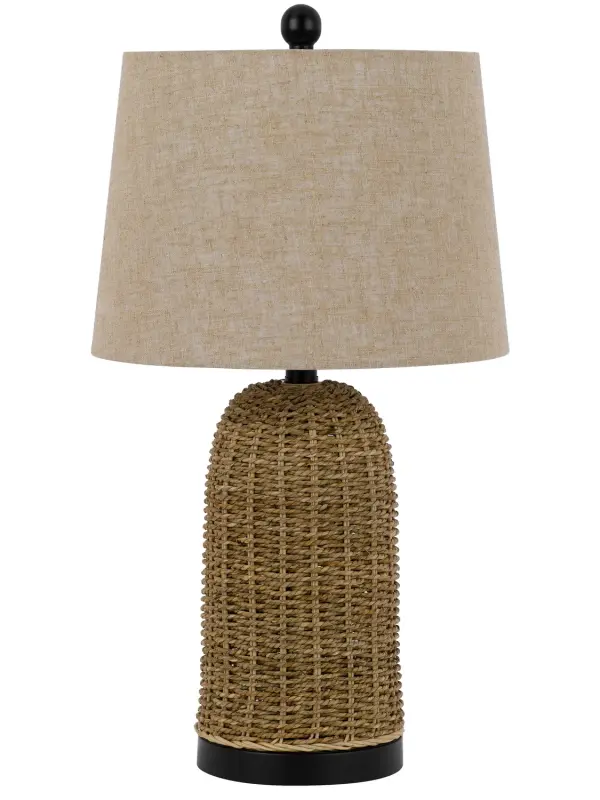 The Indio table lamp showcases handcrafted wicker construction that adds organic texture and relaxed sophistication. At 24 inches tall, it's perfectly sized for bedside tables or accent surfaces, bringing natural warmth to coastal, transitional, or organic modern interiors.