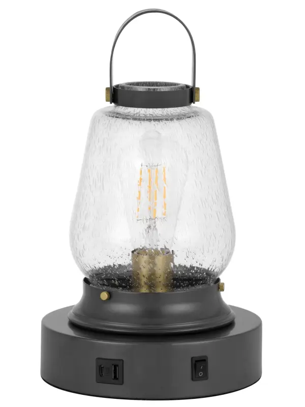 The Terri accent lamp offers understated elegance in a compact 13-inch profile. Its dark bronze finish provides versatile styling that complements both traditional and contemporary interiors.