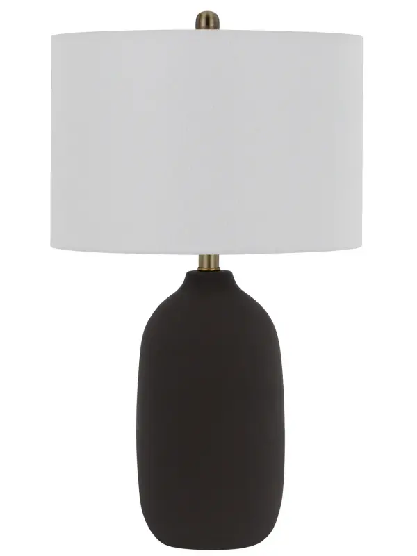 The Trani table lamp delivers modern sophistication with its matte black finish and clean lines. At 25.5 inches tall, it provides substantial presence while remaining versatile for various room settings.