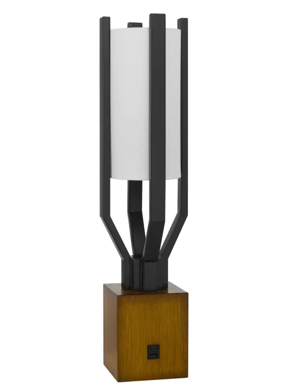 The Woodsmere table lamp combines natural wood warmth with industrial matte black accents in a sleek, compact design. At 25" tall with a slim 6" profile, it's perfect for modern spaces needing ambient lighting.