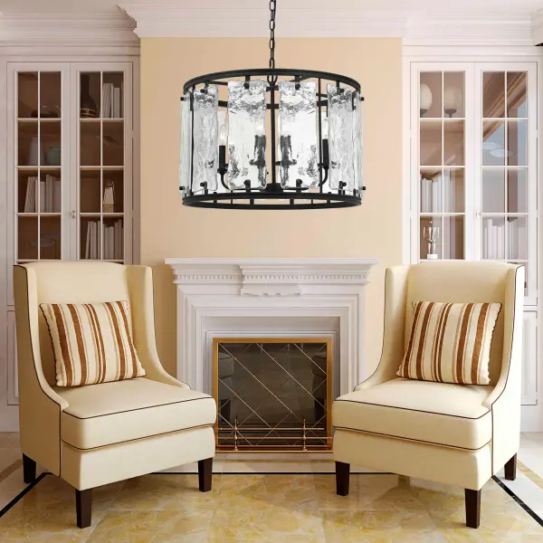 The Everette chandelier combines durable metal construction with distinctive texturized glass shade panels, creating ambient lighting perfect for dining spaces. Its 24-inch square profile suits medium-sized rooms. - alternate view