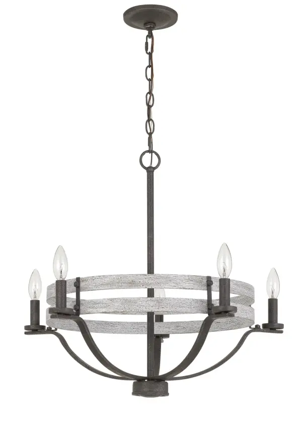 The Brig chandelier combines natural wood warmth with industrial iron accents, creating a versatile five-light fixture perfect for farmhouse and transitional spaces. Its 25-inch width makes it ideal for medium-sized dining areas.