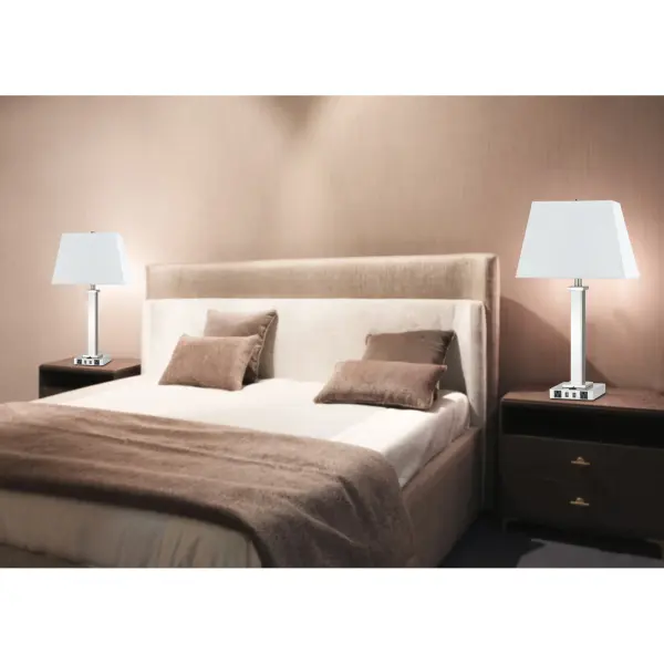 This 28-inch brushed steel nightstand lamp combines classic lighting with modern functionality, featuring two USB ports and two power outlets built into the base. Perfect for bedrooms and home offices where device charging is essential. - alternate view
