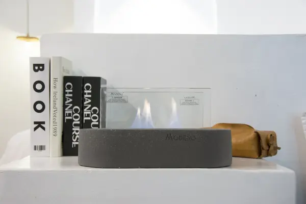The MODENO LUSPA brings authentic flame ambiance to any space with its contemporary cast concrete design. Features a stainless steel ethanol burner with 60-minute burn time and tempered glass screen for safety. - alternate view