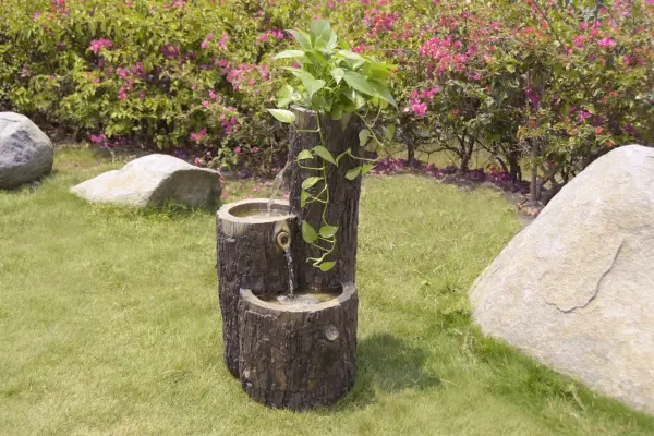 The ELEMENTI Pine Fountain Trio brings tranquil water sounds and contemporary design to outdoor spaces. Crafted from durable GRC concrete, this 31-inch tall fountain features a three-tier cascading design. - alternate view