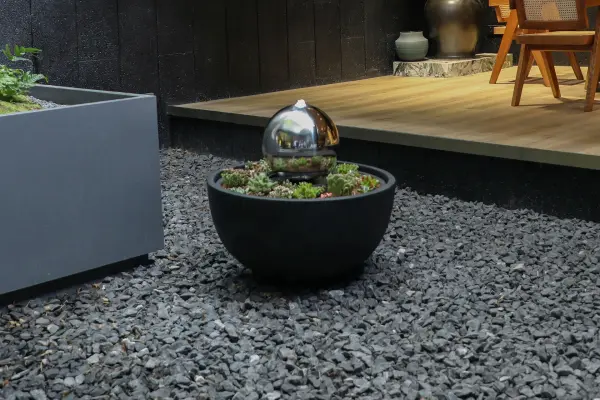 The BODHI Planter Fountain merges modern design with natural elements, featuring durable GRC construction. Its compact 26.8-inch square footprint makes it versatile for both indoor and outdoor spaces. - alternate view