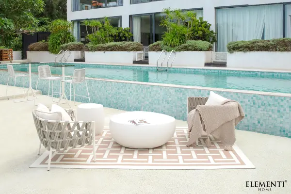 The IKARIA Cobble Coffee Table brings architectural presence with its GFRC construction. At 42" wide and 130 lbs, this substantial piece anchors living spaces with organic modern style and weather-resistant durability. - alternate view