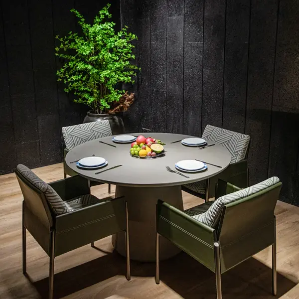 The RIO Rectangle Dining Table combines modern design with durable GFRC concrete construction. Its 48" square surface seats 4-6 guests while the weather-resistant material allows seamless indoor-outdoor use. - alternate view