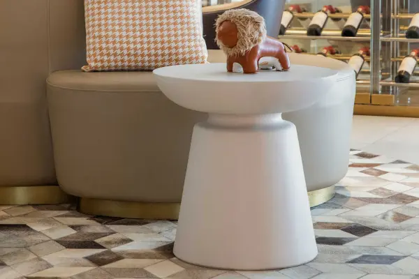 The KYLIX side table features a contemporary concrete design in cream white finish. Its 20-inch cube form and GFRC construction offer durability for both indoor and outdoor use, making it a versatile accent piece. - alternate view