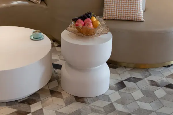 The CHRONOS side table features durable GFRC construction in a compact 17.7" square design. Its contemporary aesthetic and weather-resistant material make it suitable for both indoor and outdoor living spaces. - alternate view