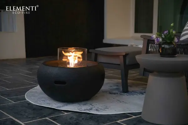The York Ethanol Fire Bowl combines handcrafted glass-fiber reinforced concrete with a stainless steel burner for versatile ambiance. With 18,000 BTU adjustable heat output and 2-hour burn time, it's ideal for both indoor and outdoor spaces. - alternate view