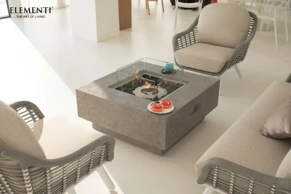 The Manhattan Ethanol Fire Table combines contemporary design with functional warmth. Featuring handcrafted glass-fiber reinforced concrete construction and a 304 stainless steel burner, it delivers up to 28,000 BTUs of adjustable heat for 2-5.5 hours of burn time. - alternate view