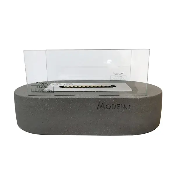 The Luspa ethanol tabletop fireplace combines contemporary concrete design with the warmth of real flames. Features cast concrete construction, stainless steel burner, and protective tempered glass screen for safe indoor use.