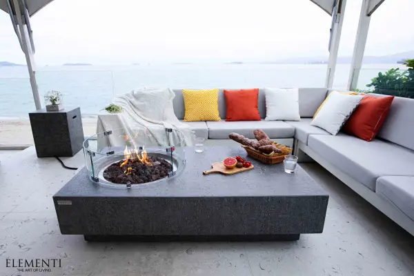 The Elementi Metropolis Fire Table combines contemporary design with powerful heating capability. Handcrafted from glass-fiber reinforced concrete with stainless steel burner components, this outdoor fire table delivers 45,000 BTUs. - alternate view