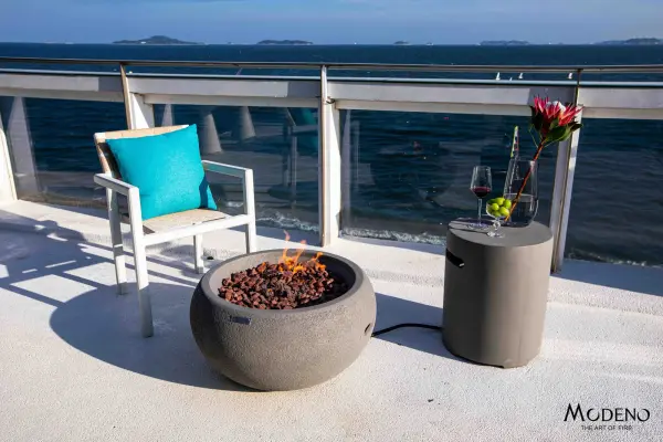 The Modeno Newbridge Fire Bowl combines modern design with powerful heating capability. Constructed from glass-fiber reinforced concrete with a stainless steel burner system, it delivers 40,000 BTUs of warmth for outdoor entertaining. - alternate view