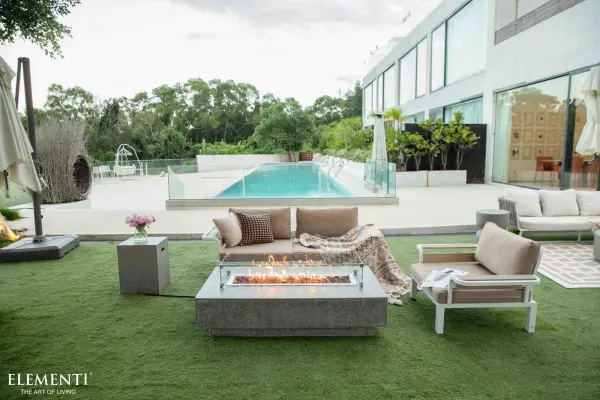 The Hampton Fire Table combines contemporary design with powerful heating capability. Featuring handcrafted glass-fiber reinforced concrete construction and a 30-inch stainless steel burner, this outdoor centerpiece delivers both ambiance and warmth. - alternate view