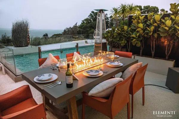 The Elementi Sonoma combines sophisticated outdoor dining with a dramatic 30-inch fire feature. Handcrafted concrete top paired with natural ashwood base creates a striking centerpiece for patios and outdoor entertaining spaces. - alternate view
