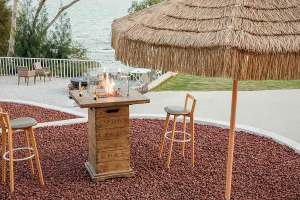 The Elementi Rova combines functional bar-height dining with a powerful propane fire feature. Handcrafted from glass-fiber reinforced concrete with stainless steel burner components, it delivers restaurant-quality ambiance. - alternate view