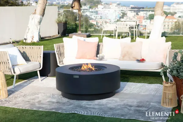 The Elementi Plus Nimes Fire Table combines handcrafted glass-fiber reinforced concrete with a powerful 60,000 BTU burner system. This substantial outdoor centerpiece features premium stainless steel components and includes everything needed for immediate enjoyment. - alternate view