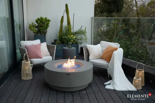The Colosseo Fire Table combines handcrafted glass-fiber reinforced concrete construction with a powerful 60,000 BTU burner system. Features include push-button ignition, stainless steel components, and complete accessory package. - alternate view
