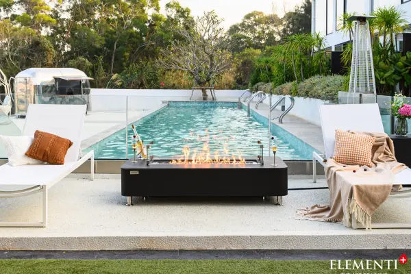 The Valencia Fire Table combines handcrafted glass-fiber reinforced concrete with elegant marble porcelain top, delivering 60,000 BTU heat output. Features 30-inch stainless steel burner, push-button ignition, and includes bronze fire glass. - alternate view
