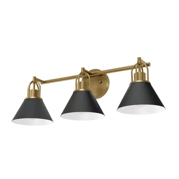 Create a cohesive, elevated look with the Carrington Isle 3 Light Medium 27 Inch Vanity. This transitional bathroom vanity light blends relaxed elegance with bold, modern contrast. Sleek metal shades and warm gold accents add depth and luxury—perfect for layered lighting in contemporary bathrooms or vanity spaces. Part of the Carrington Isle Jasmine Roth Collection, it coordinates beautifully with other fixtures in this collection for a unified, designer-inspired feel. Ideal for those seeking stylish, high-performance bathroom lighting. Rated for Indoor Use Only. Down Mount Only TRANSITIONAL: Light, relaxed, elegant. Sleek metal shades with warm gold accents for a striking finish. MADE FOR INDOORS: For use in indoor bathrooms. BULB RECOMMENDATION: Maximum 60 W (E26) per light bulb or equivalent LED bulb. Bulbs not included. COORDINATING COLLECTION: Works with the Carrington Isle Jasmine Roth Collection ceiling fan collection. ELEVATED CONTRAST: Sleek metal shades bring bold definition while warm gold accents add a touch of luxury—perfect for creating a layered, contemporary look that shines in any space. TRANSITIONAL: The transitional style celebrates natural light and a relaxed feel with smooth, blending details that create warm yet modern spaces with the best of both worlds; elegant, minimal and adaptable. FITS YOUR WALL: Measures 27.1 wide by 8.76 high, with an 8.15 wall projection and a 5.12 round backplate—all in inches. WARRANTY: One-year limited warranty backed by the trusted experts at Hunter.