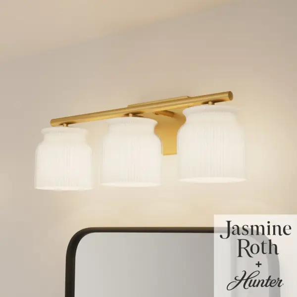 The Harlowe vanity light combines contemporary elegance with practical functionality. Its ribbed milk glass provides even, flattering illumination while the matte bronze finish adds warmth and sophistication to any bathroom.