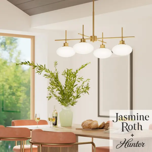 The Getty chandelier brings refined modern elegance to dining spaces with its distinctive ellipse-shaped milk glass and luxe gold finish. The single-tier design creates a striking focal point while providing even, diffused illumination. - alternate view