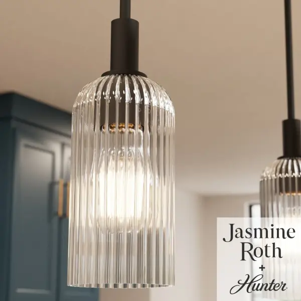The Beverly Glen Mini Pendant combines contemporary design with timeless appeal through its scratch-resistant ribbed amber glass and matte bronze finish. Perfect for kitchen islands and intimate dining spaces, this compact fixture delivers warm, inviting illumination while adding modern sophistication to any room. - alternate view